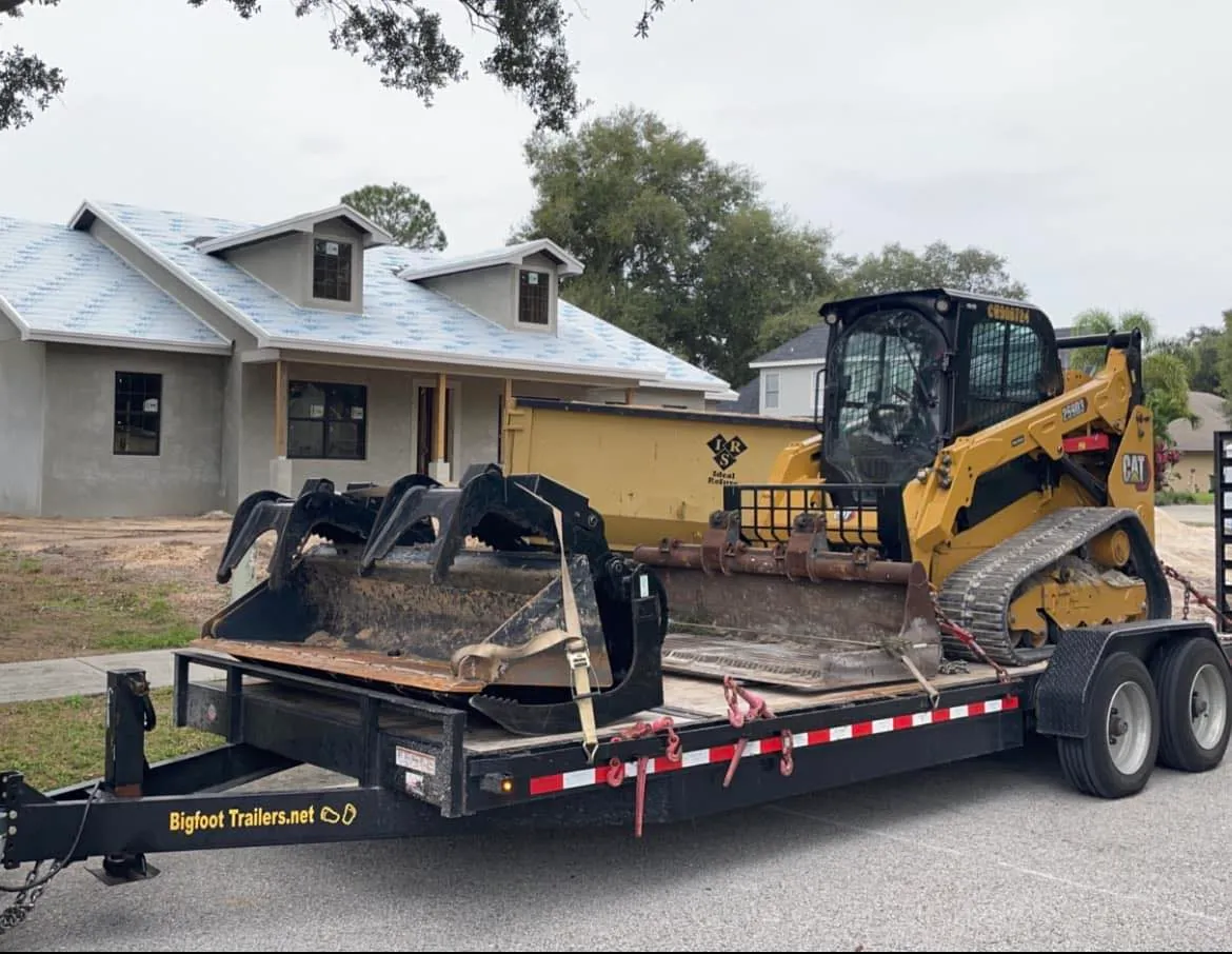 Florida Site and Septic excavator loaded on a trailer at a Lakeland home